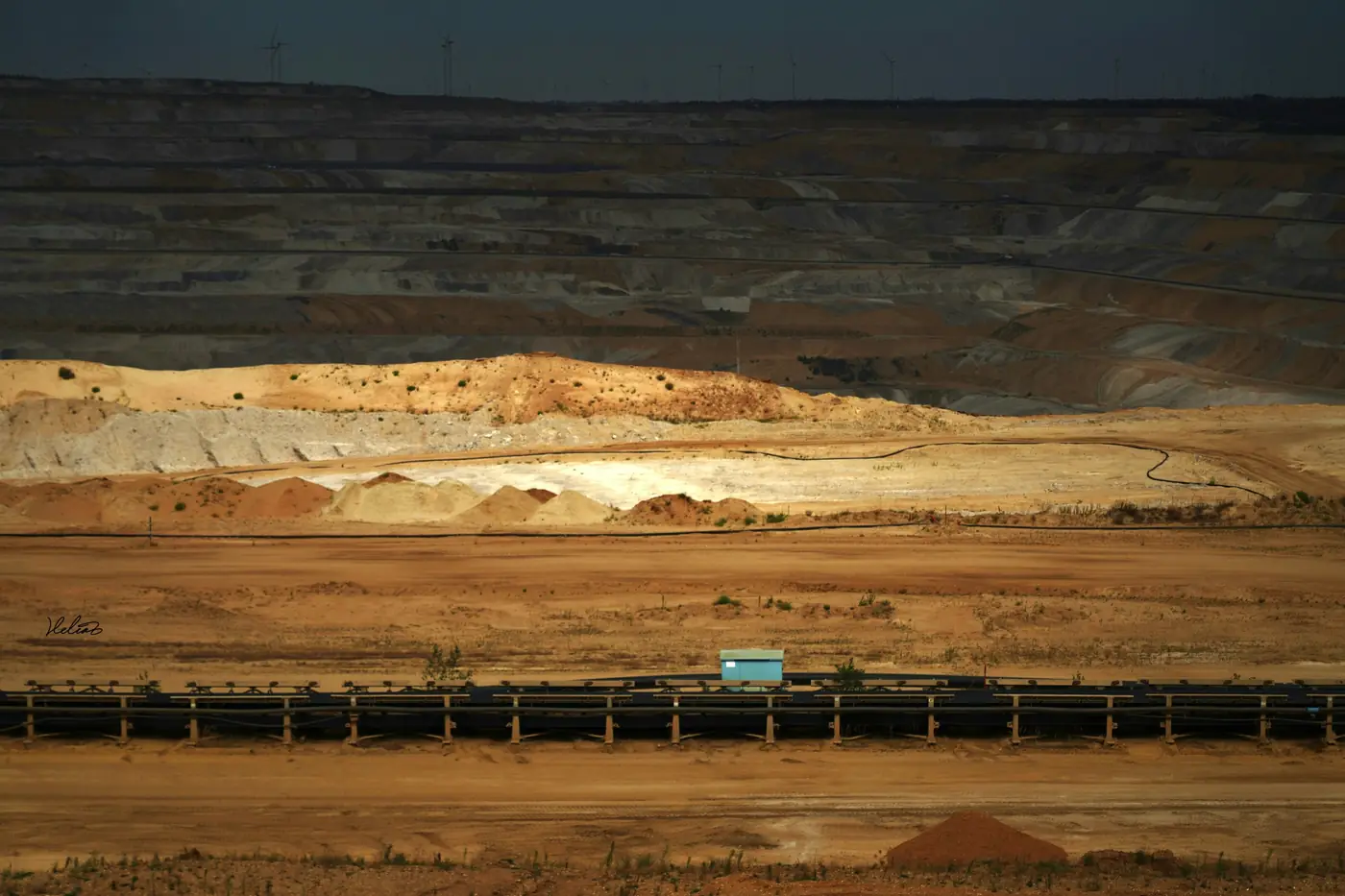 A conveyor crossing an open-pit mine